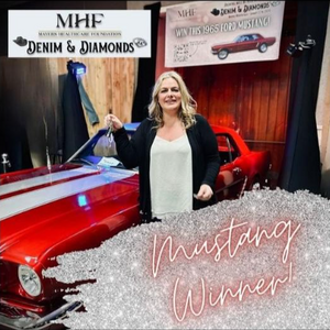 Female Mustang Winner standing next to her new car.
