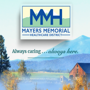 Picture of a barn and mountains in the background. Always caring, always here